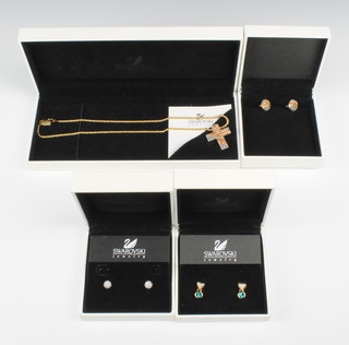 A Swarovski crystal cross and chain and 3 pairs of Swarovski earrings, all boxed