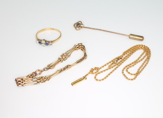A yellow gold bracelet, a necklace, a tie pin, a gem set ring, 5 grams