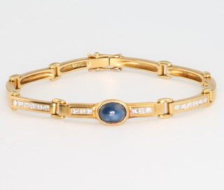 An 18ct yellow gold cabouchon cut sapphire and diamond bracelet, 24 grams