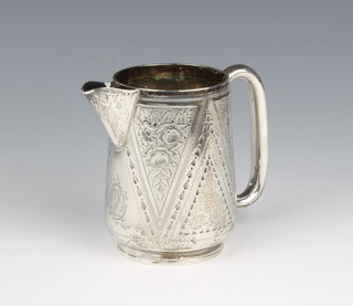A Victorian silver jug with chased floral decoration, 130 grams