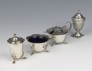 A silver three piece condiment on paw feet, Birmingham 1958, together with a weighted pepper,weighable silver 114 grams