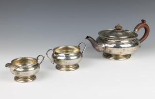 A 3 piece silver tea set of bulbous form with fruitwood mounts, Birmingham 1926, gross weight 522 grams
