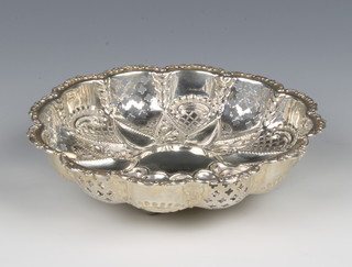 A Victorian repousse and pierced silver bowl decorated with scrolls and flowers 6"h, Birmingham 1897, 130 grams