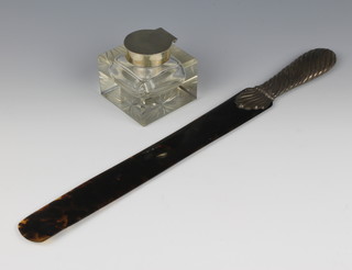 A Victorian repousse silver paper knife/page turner with tortoiseshell blade, London 1890, 16 1/2" l together with a silver mounted inkwell