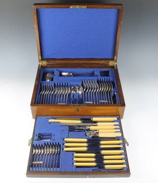An oak canteen containing a suite of plated cutlery for 6, 60 pieces