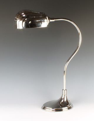 A plated desk lamp with scalloped shade