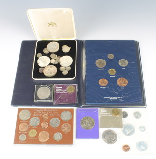 A folder "Coins of Great Britain 1967" four silver proof coins and a quantity of English coinage