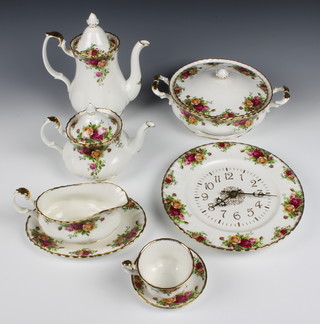 A 67 piece Old Country Rose pattern tea/dinner service comprising tea pot, 6 side plates 8"d, cream jug, sugar bowl, 2 mugs, 8 cups and saucers, 6 coffee cans and saucers, tea and coffee pot - all firsts, an oval meat plate, sauce boat and stand, 2 vegetable tureens and covers 9", a circular plate 13"d, 6 plates 10 1/2", 6 tea plates 6 1/2", 6 bowls 8", an oval twin handled dish 10", a rectangular twin handled dish 12" - all seconds