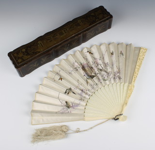 A 19th Century carved Cantonese ivory and silk fan, the silk embroidered exotic birds in a wooden fitted case, contained in a Chinoiserie case decorated with figures before pavilions 12 1/2"
