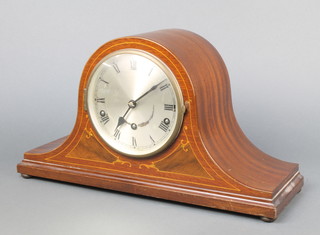 A chiming mantel clock with silvered dial with Roman numerals contained in a mahogany Admirals hat shaped case