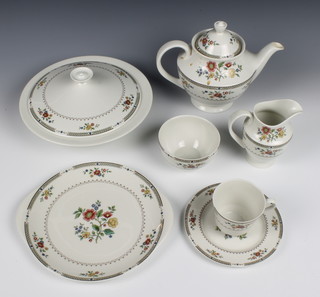 A 41 piece Royal Doulton Kingswood pattern dinner service comprising 2 tureen and covers 10 1/2", 6 dinner plates 10 1/2", 6 side plates 8", a twin handled bread and butter plate, 6 medium plates 6 1/2", 6 bowls 6 /12" bowls, 5 bowls 5", a tea pot sugar bowl and cream jug, 6 tea cups and saucers 