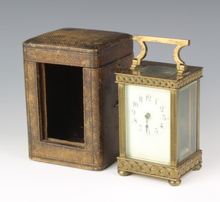 A 19th Century French 8 day carriage timepiece with enamelled dial, arabic numerals contained in a gilt metal case, complete with leather carrying case