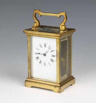 A 19th Century 8 day carriage timepiece with enamelled dial with arabic numerals contained in a gilt metal case, 4 1/2"h x 3"w x 2 1/2" d