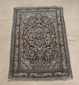 A blue and pink ground Persian Dorokhsh rug 78"x 49", in wear with some moth