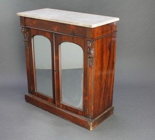 A Victorian rosewood chiffonier with white veined marble top, fitted a drawer above a cupboard  enclosed by a pair of arched mirrored doors and raised on a platform base 36"h x 33"w x 15"d