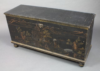 A black lacquered coffer with Chinoiserie decoration raised on bun feet 24"h x 47"w x 16"d
