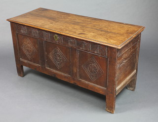 An 18th Century oak coffer of panelled construction, with carved panels and iron lock 22"h x 42"w x 17"d
