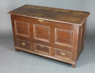 An 18th Century oak mule chest the interior fitted a candle box, the base fitted 1 long drawer with geometric mouldings  28 1/2" h x 37" l x 20 1/2" d