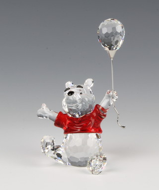 A Swarovski figure "Winnie the Pooh with Balloon" No 905768/9100000079, 4"h, contained in a fitted box
