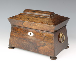 A William IV rosewood sarcophagus shaped twin compartment tea caddy with ring drop handles and ivory escutcheon raised on bun feet 5 1/2"h x 9"l x 5 1/2"d