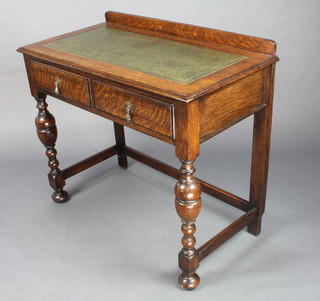 An Edwardian oak writing table with raised back inset leather writing surface fitted 2 shorr drawers, raised on cup and cover supports 32"h x 36"w x19"d