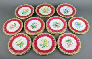 A 19th Century 19 piece dessert service with red and gilt banding and floral painted decoration to the centre, comprising 3 comportes (all cracked) and 16 plates 23cm (some with contact marks) 
