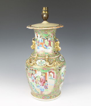 A late 19th Century Cantonese baluster vase decorated with panels of figures in pavillions on a ground of flowers, butterflies, insects and birds, converted to electricity 33cm 