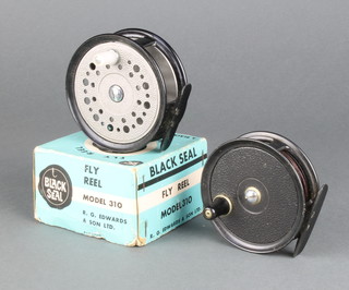 A J W Young Condex fishing reel with silk line and a black seal 300 fly reel boxed 