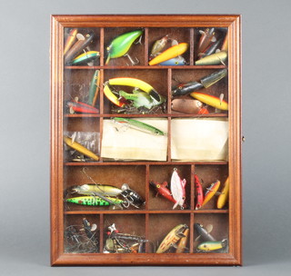 A collection of lures by ABU, Hendon, Hardy and others contained in a display case    4 x 31 x 42cm 