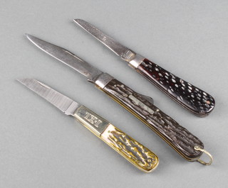 3 Wostenholm knives all stamped IXL George Wostenholm Sheffield England - a lock back folding hunting knife with 8cm blade and imitation stag horn grip and steel bolsters, a jack knife with jigged bone handle  and a late 20th Century knife 


