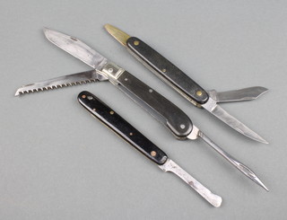 3 Victorinox knives all stamped Victoria comprising 2 budding knives stamped 462/105 and 473 and 1 other knife with 7.5cm blade, saw and leather needle, white metal bolster and polished grip 
