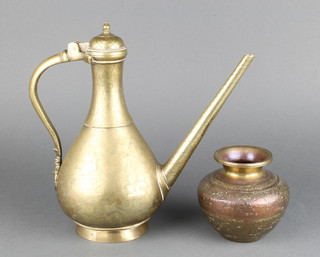 An Indian engraved polished bronze ewer 18cm, together with a circular embossed copper and brass  vase