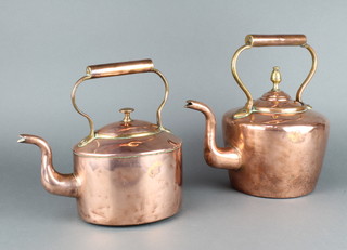 A Victorian circular polished copper tea kettle with brass finial 13cm (finial has been re-soldered) together with an oval ditto 19cm 