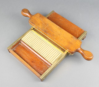 A 19th Century brass and mahogany pill rolling machine 31cm long