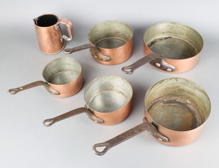 5 various circular saucepans 22, 18, 16, 14 and 12  measuring 16cm, 14cm, 12.5cm, together with a copper jug  12cm 
