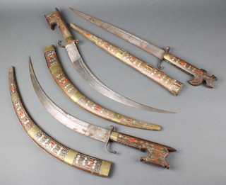 An Indian sword with white metal and brass inlaid hardwood scabbard and grip together with 2 ditto swords with 16" curved blades