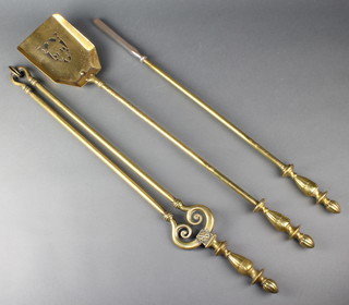 A Victorian Adams style fireside companion set comprising poker, shovel and tongs with urn finials