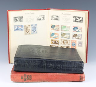 A Nelson album of mint and used world stamps and 2 Triumph albums of mint and used world stamps 