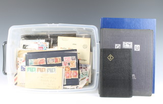 A stock book of various GB stamps Elizabeth II, a black album of world stamps, early first day covers, presentation stamps etc 