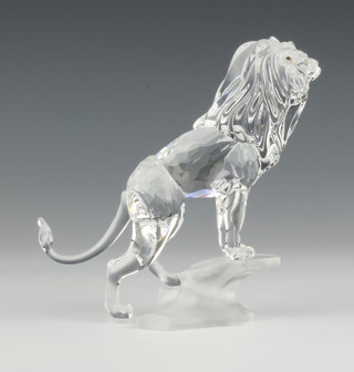A Swarovski figure "Lion" (on a rock) NO 269377/7610000004 designed by Martin Zendron, contained in a fitted case