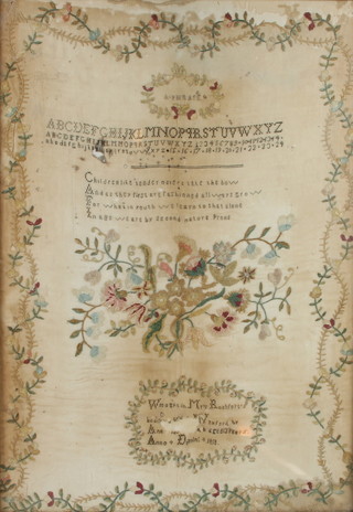 A George III woolwork sampler with alphabet and motto, marked Mrs Rochefort's anno domini 1818    62cm x 43cm