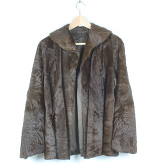A brown fur coat with some wear to the arms and cuffs