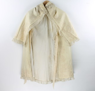 A Victorian lady's white fabric cape with embroidered decoration together with a ditto bonnet