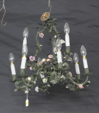 A French Art Deco metal and porcelain 9 light electrolier with flowerhead and leaf decoration, approx 46cm diam. 