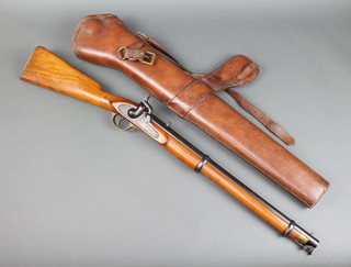 An Enfield 2 bar cavalry carbine, the lock and stock with crown marked EIG Birmingham, with stirrup ram rod, the barrel measures 54cm, together with a brown leather boot 