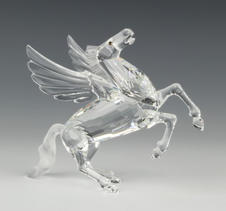 A Swarovski figure "Pegasus" No 216327/7400098000 designed by Adi Stocker, complete with stand and contained in a fitted box 