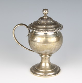 A Georgian style baluster shaped silver sugar caster on a spreading foot, London 1911 by Aspreys, 248 grams