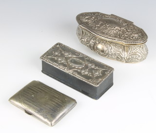 A Victorian repousse silver dressing table box with hinged lid, Birmingham 1886, 120 grams (holes to lid) together with an Edwardian leather and silver box with hinged lid Birmingham 1907 3cm x 5cm and a silver plated cigarette case 