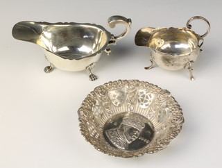 A silver sauce boat, Birmingham 1940, one other and a silver repousse dish, 160 grams