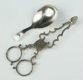 A pair of Georgian silver sugar nips together with a George III silver bright cut caddy spoon London 1801, 39 grams 